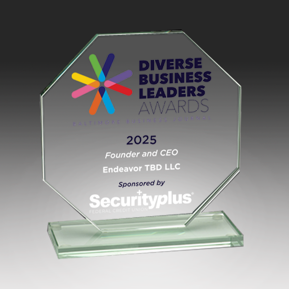 Glass award with 'Diverse Business Leaders Awards' logo and text on a dark background