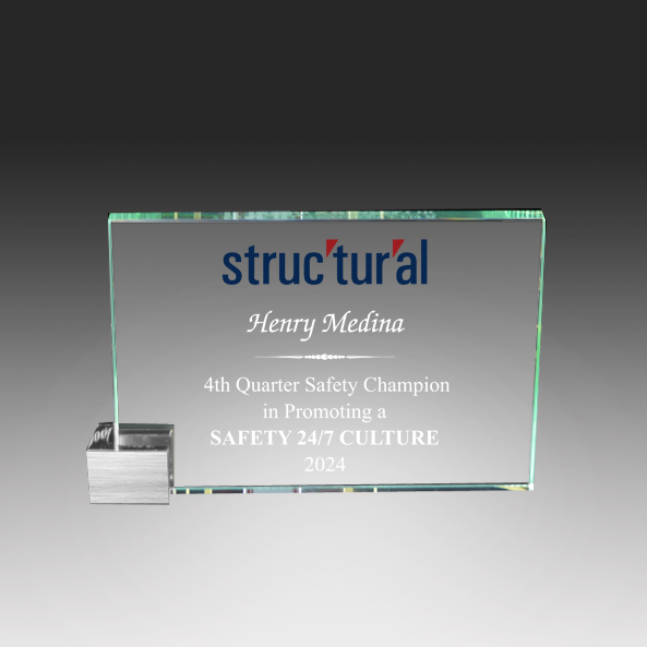 Glass award with 'Structural' logo and text on a gray background