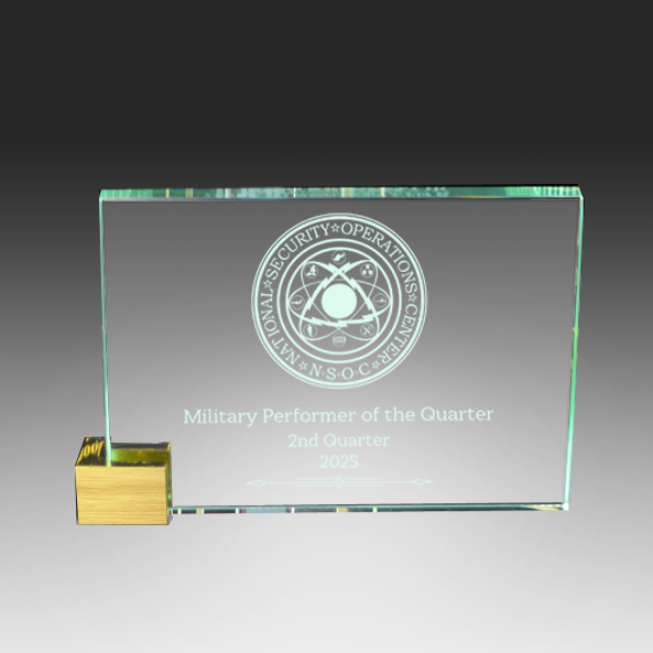 Glass award with military emblem and text on a gray background in Norfolk, Virginia