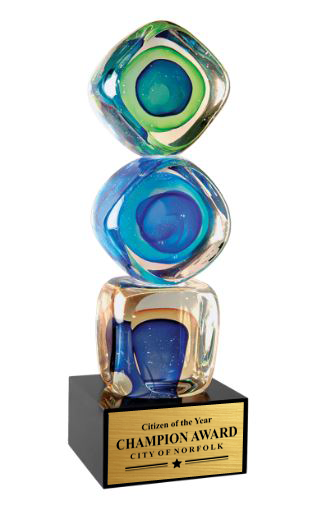 Colorful glass award with 'Citizen of the Year Champion Award' text on a black base