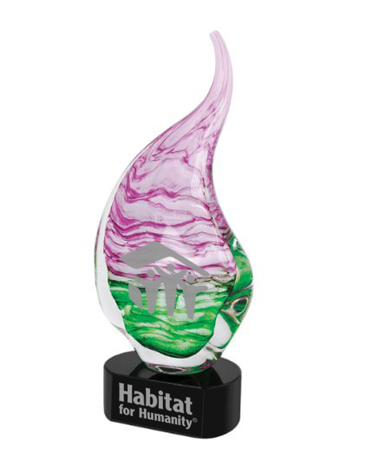 Decorative object with pink and green design on a black base, featuring 'Habitat for Humanity' branding located in Baltimore, MD