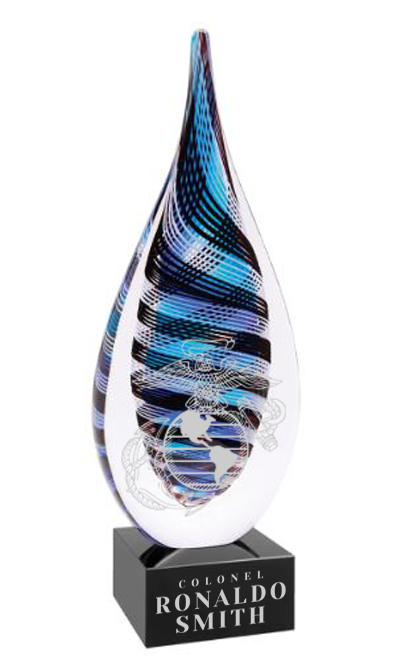 Decorative glass award with blue and white swirl design on a black base, featuring text in Catonsville, MD