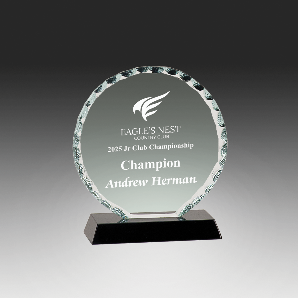 Crystal award with engraved text on a gray background in Norfolk, VA