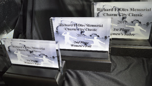 GROUP OF 3 LANDSCAPE ACRYLIC AWARDS IN BLACK WOOD BASES. FENCING AWARDS IN BALTIMORE MARYLAND