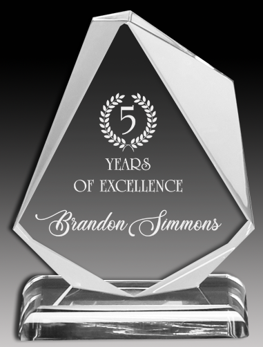Clear acrylic award with '5 Years of Excellence' engraved on a black background