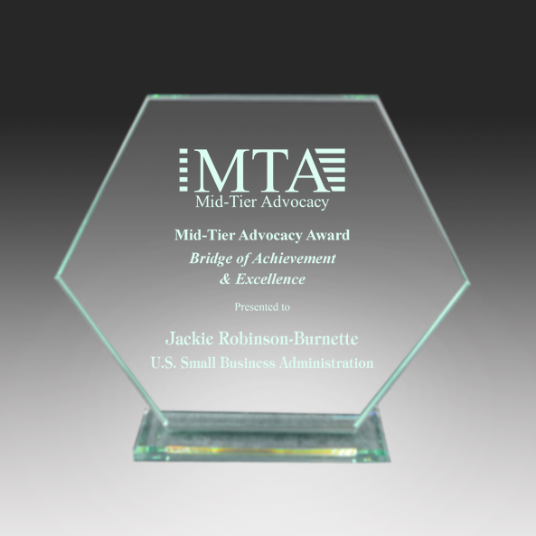 Glass award with engraved text and MTA logo on a gradient background