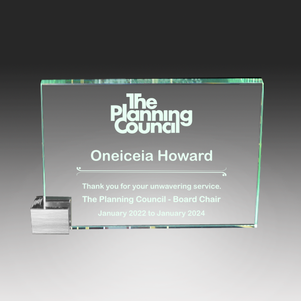 Glass award with engraved text for 'The Planning Council' on a gray  background in Norfolk, Virginia