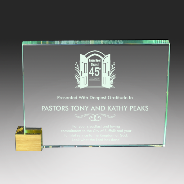 Glass plaque with engraved text and logo on a dark background Norfolk, Virginia