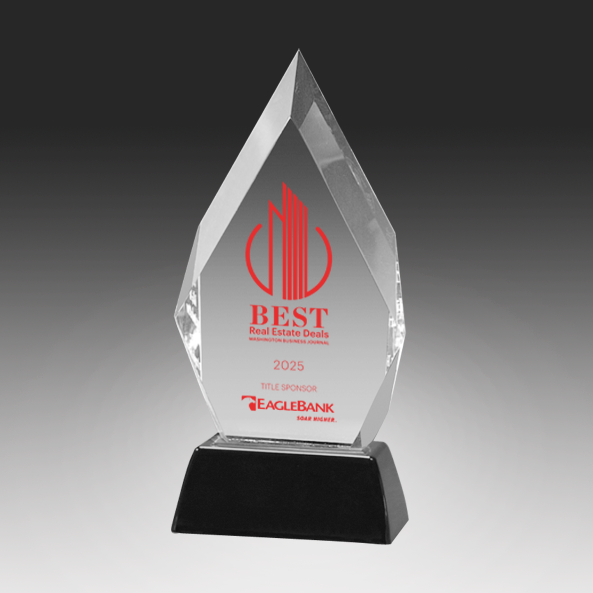 Acrylic award with red and black text on a gray background