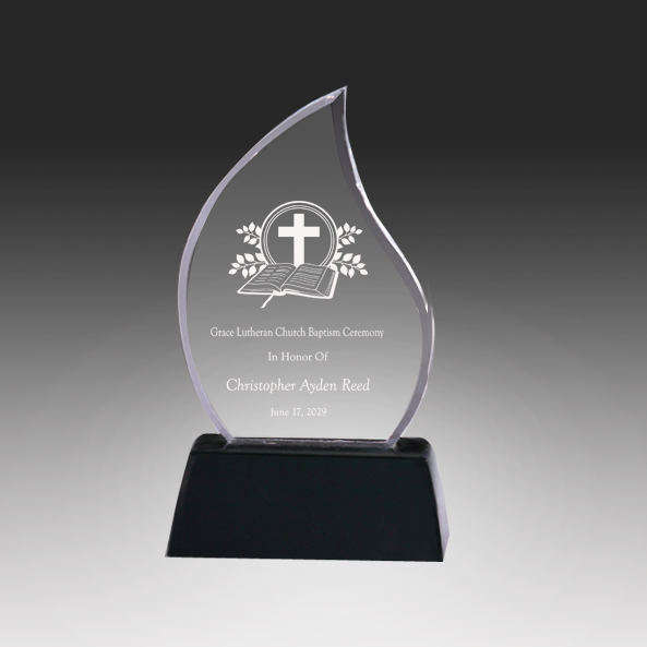 Acrylic award with religious design on a black base against a gray background