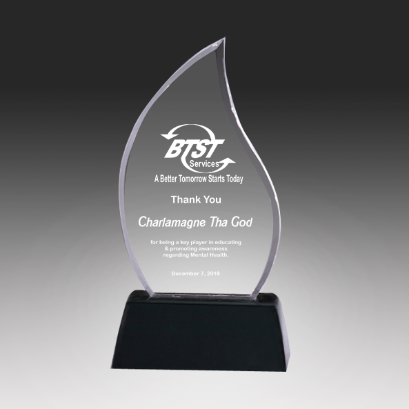 Acrylic award with engraved text on a black background