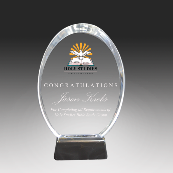 Clear Acrylic award with engraved text and 'Holy Studies' logo on a dark background