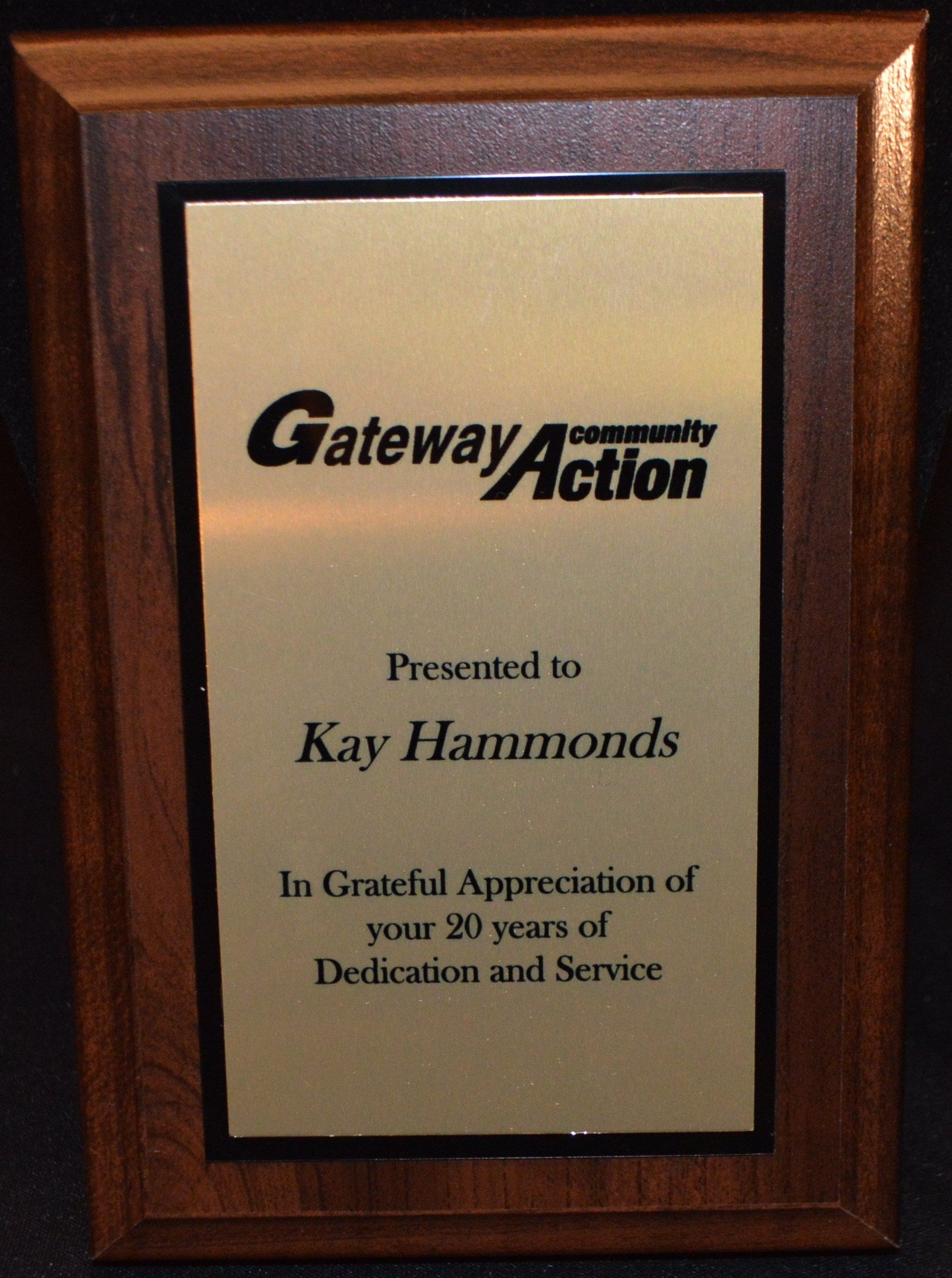 Plaque from Gateway Community Action presented to Kay Hammonds for 20 years of dedication and service.