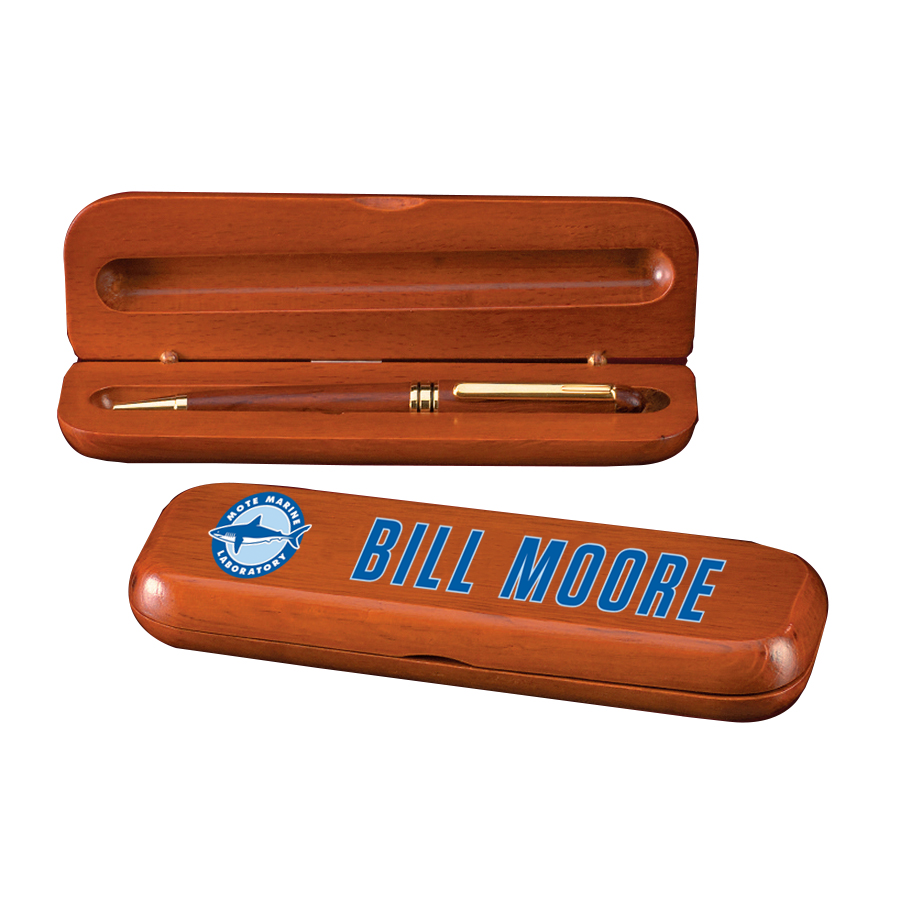 Wooden pen case with pen and closed lid displaying 'Bill Moore' branding on a white background.  Norfolk, VA