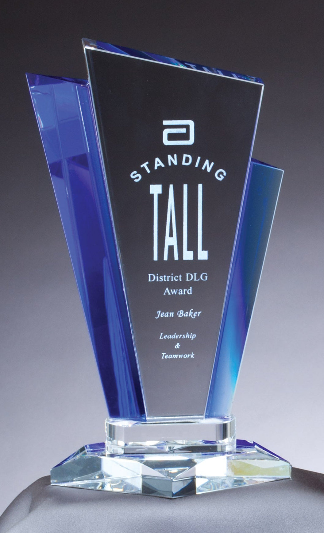 Two crystal awards with blue accents on a gray fabric background