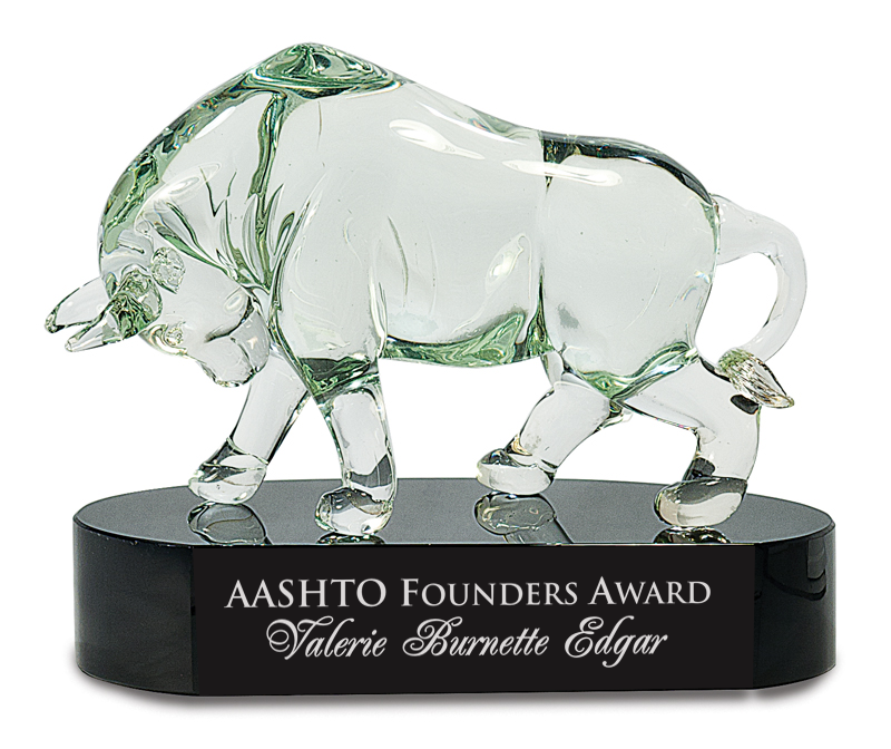 Glass bull figure on a black base with engraved text, labeled 'Aashto Founders Award'.