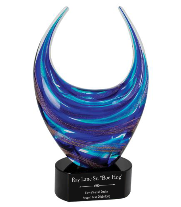 Blue glass sculpture on a black base with engraved text in Suffolk, VA