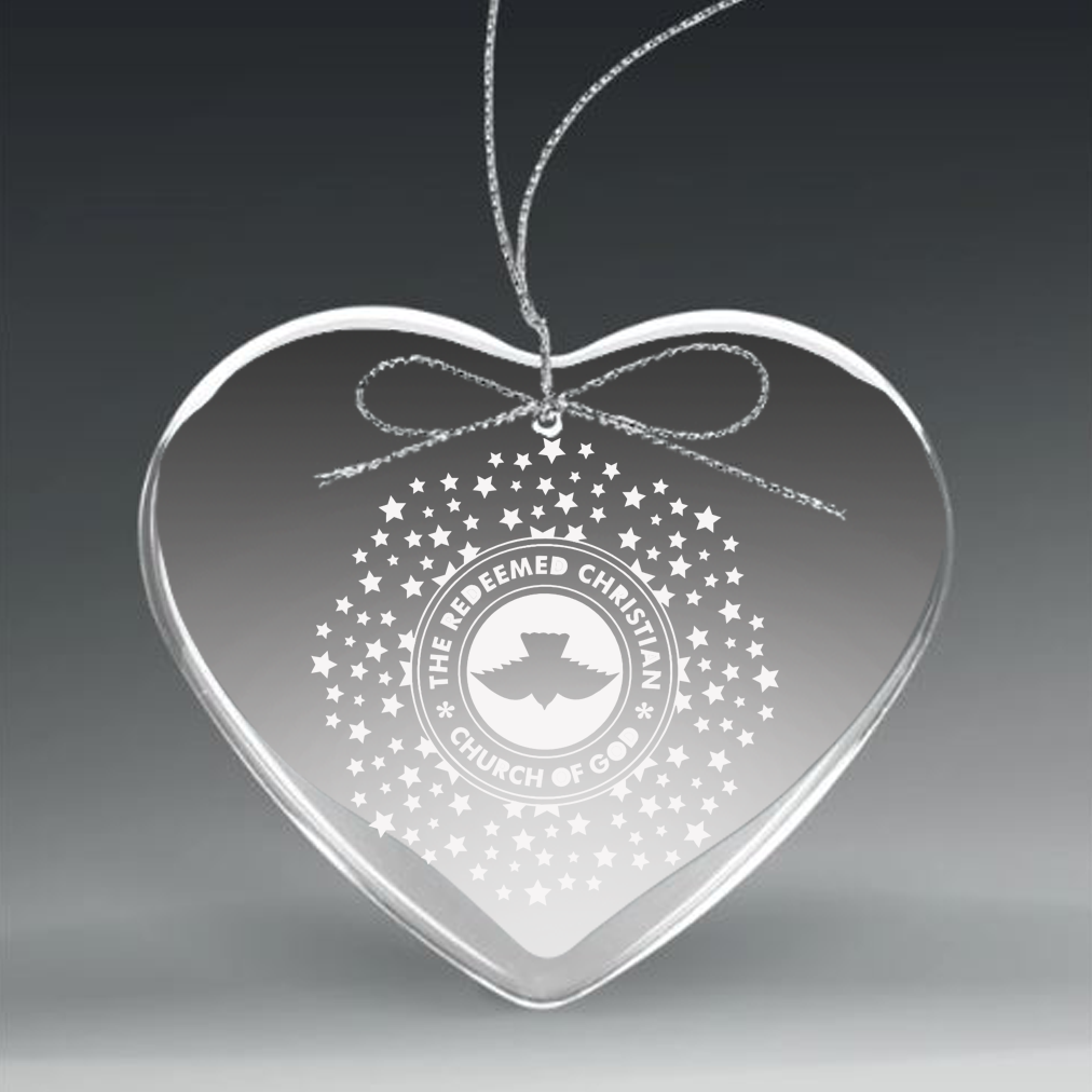 Clear heart-shaped ornament with engraved logo and text on a dark background in Baltimore Maryland