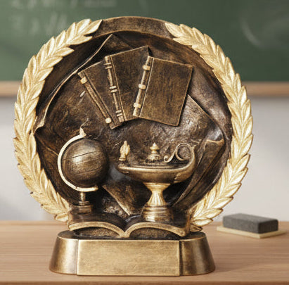 Bronze educational trophy with books, globe, and graduation cap on a laurel wreath background