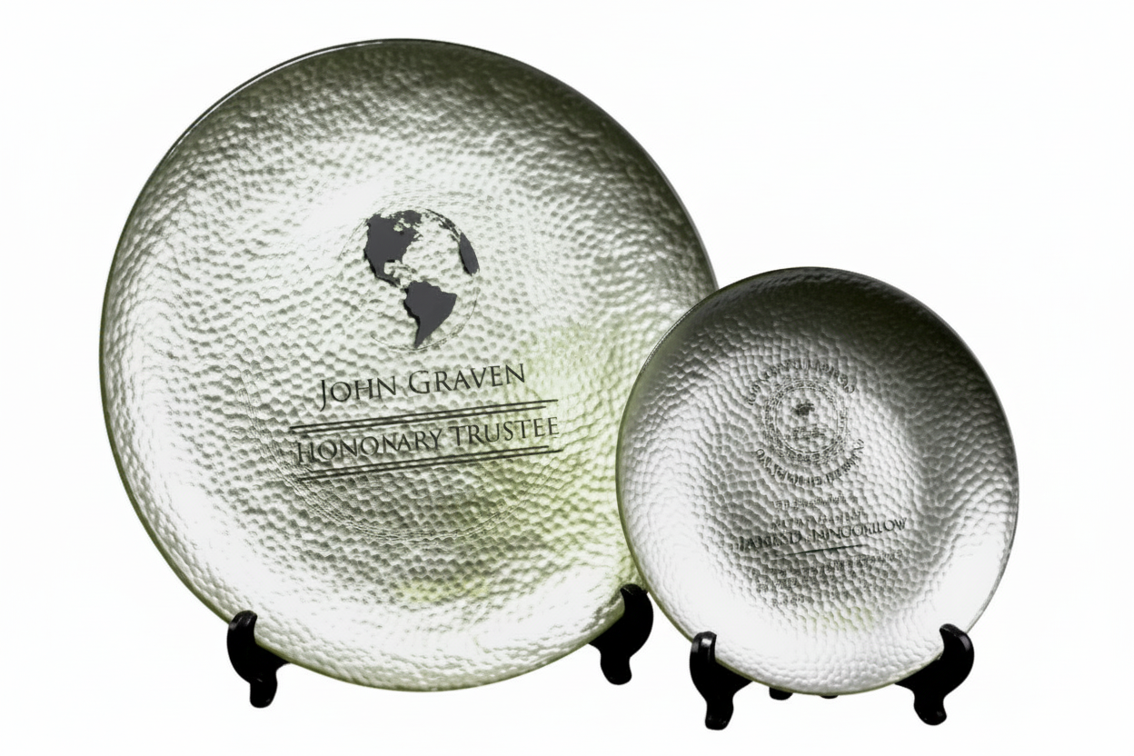 Two metallic glass trays on a white background