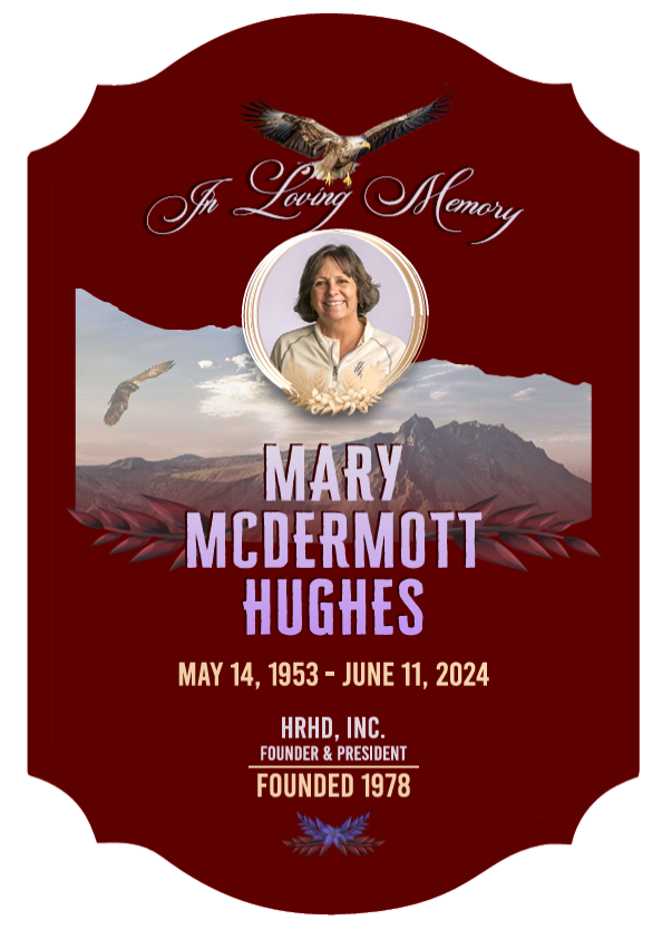 Memorial plaque with a portrait and mountain background.