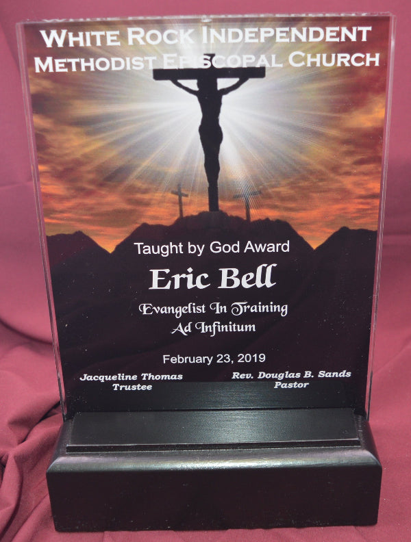 Award with a religious design on a red fabric background